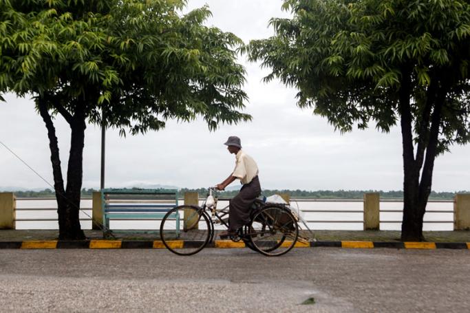 A man drives a trishaw at the strand road of Mawlamyine, Mon State, Myanmar. Photo: Lynn Bo Bo/EPA