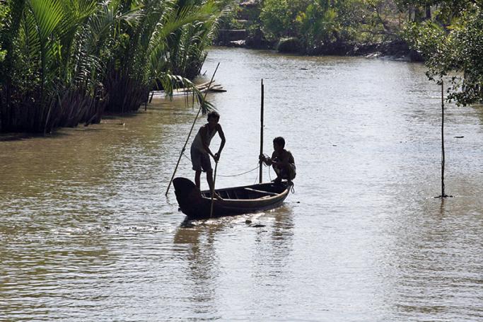 Myanmar men fishing in the river at Thagyarhinoh village, Pyarpone, Ayeyawaddy delta. Photo: Nyein Chan Naing/EPA