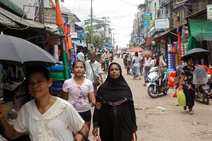 People walking in a street in Mawlamyine city, Mon State, Myanmar. Photo: Lynn Bo Bo/Mizzima