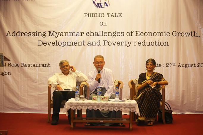 Visiting Indian economists Prof. C P Chandrasekhar, left, and Prof. Jayati Ghosh, right, being introduced at the public talk held in Yangon. Photo: Thet Ko/Mizzima