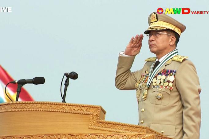 This screengrab provided via AFPTV and taken from a broadcast by Myawaddy TV in Myanmar on March 27, 2021 shows the country's military chief, Min Aung Hlaing, saluting during an annual parade put on by the military to mark Armed Forces Day in the capital Naypyidaw. Handout / AFPTV / Myawaddy TV / AFP