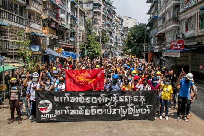 This photo taken and received from an anonymous source via Facebook on March 27, 2021 shows protesters taking part in a demonstration against the military coup in Yangon. Handout / FACEBOOK / AFP