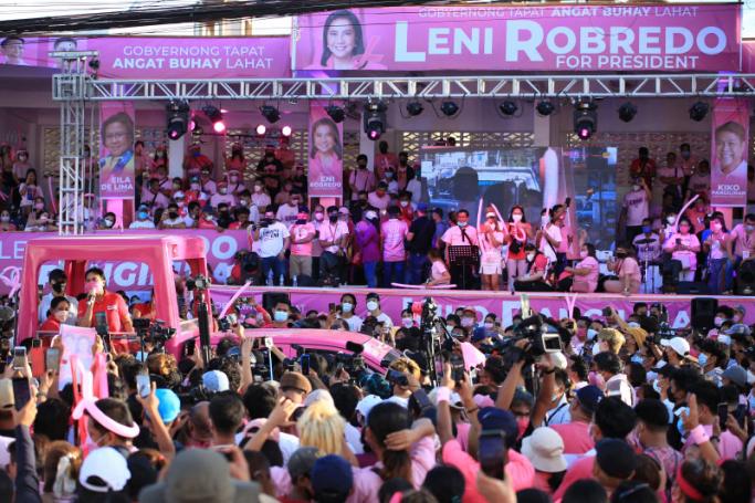 Leni Robredo (L, in a vehicle) Philippines' Vice-President and opposition presidential candidate speaks to supporters during a campaign rally in Iriga city, Camarines Sur province, south of Manila on February 8, 2022. Photo: AFP