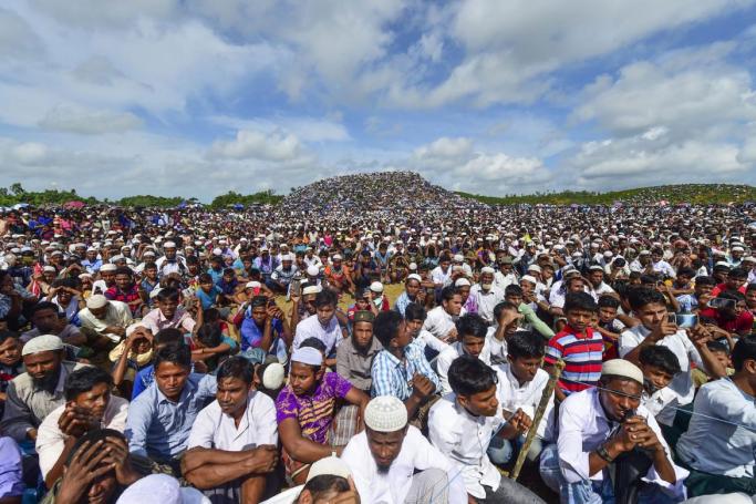 Rohingya refugees attend a ceremony organised to remember the second anniversary of a military crackdown that prompted a massive exodus of people from Myanmar to Bangladesh, at the Kutupalong refugee camp in Ukhia on August 25, 2019. Photo: Munir Uz Zaman/AFP