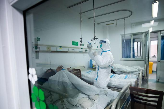 Medical staff work at Wuhan Jinyintan hospital, which specializes in the treatment of severe new coronavirus infected patients transferred from various hospitals in Wuhan City, Hubei Province, China, 26 January 2020. Photo: EPA