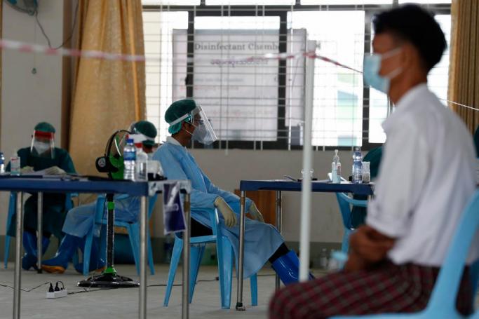 (File) A doctor waits for patients inside the Community Fever Clinic which opens, temporarily, at Hlaing Thar Yar town hall in Yangon, Myanmar, 29 April 2020. Photo: EPA