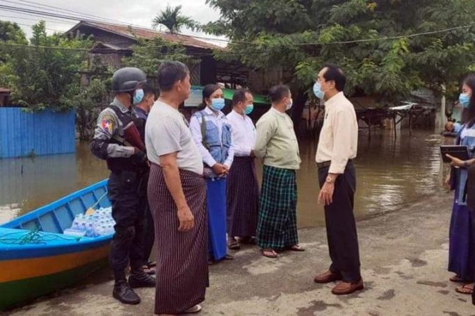 Officials inspecting the flooded areas in Kachin State yesterday. Photo: MNA