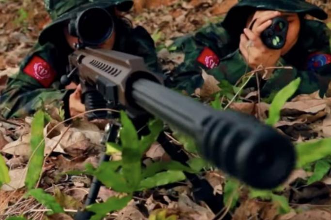 Arakan Army soldiers take aim from an undisclosed location in Myanmar. Photo: Arakan Army Video