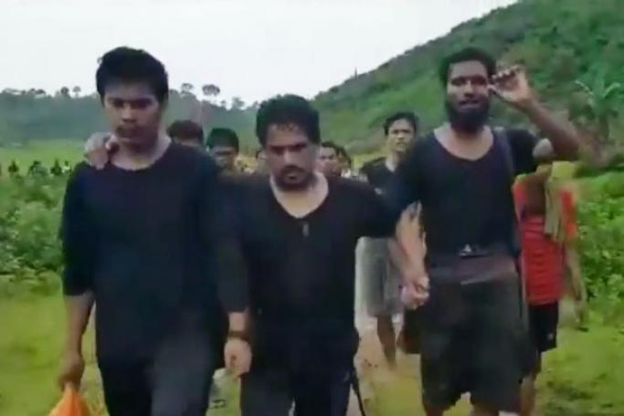 Ataullah Abu Amar Jununi, centre, heads the Arakan Rohingya Salvation Army (ARSA video, YouTube screengrab)