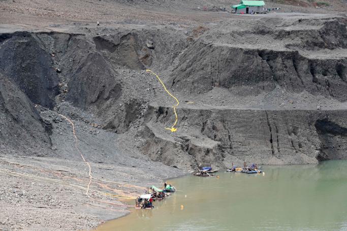 Miners search for jade stones inside the HpaKant jade mining area, Kachin State, northern Myanmar, 16 July 2019. Photo: Nyein Chan Naing/EPA