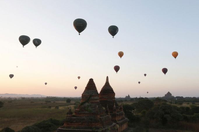Balloons carrying visitors fly at sunrise over old temples of the ancient temple city of Bagan, Mandalay Region, Myanmar. Photo: Hein Htet/EPA