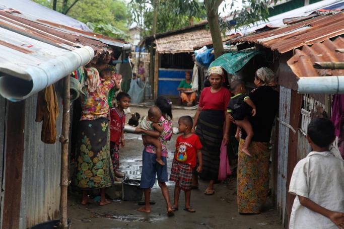 In this photo taken on July 4, 2021, members of the internally displaced Rohingya community gather by their makeshift shelters at the Baw Du Pha IDP Camp in Sittwe in Myanmar's western Rakhine state. Photo: AFP