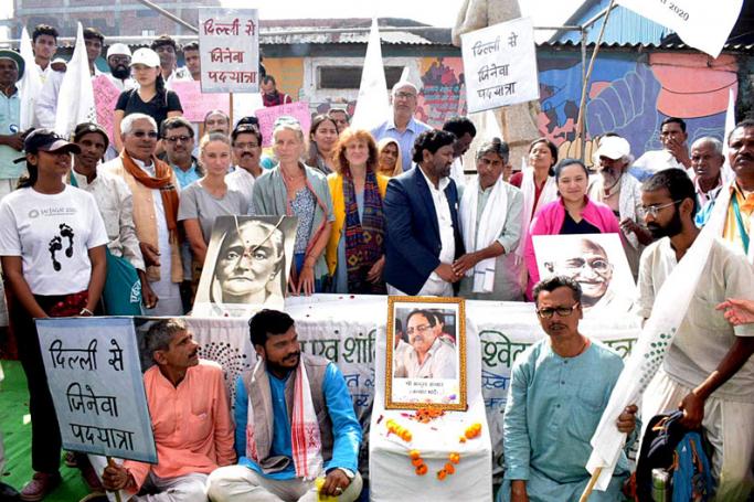 Peace messengers of Jai Jagat pay tribute to the victims of Bhopal gas tragedy at the gas memorial in front of the abandoned Union Carbide during their Global march for Justice and Peace in Bhopal on Tuesday. The Jai Jagat Yatra started from Delhi on Oct 2, 2019, will culminate in Jeneva (Switzerland) on Oct 2, 2020. (ANI Photo) 