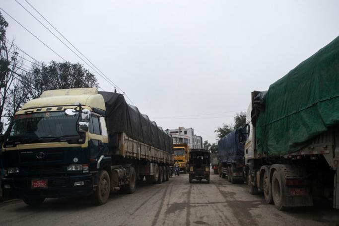 Trucks carrying goods waiting to cross the border into China from Muse in Myanmar's Shan state. Photo: Ye Aung Thu/AFP