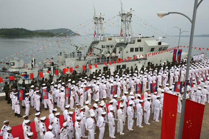 (File) Cambodian naval personel stand as they wait for the welcoming delegation for a handover ceremony for nine naval patrol boats donated by China, at the Cambodia Naval Base in Sihanouk Ville, some 220 kilometers south-west of Phnom Penh, 07 November 2007. Photo: AFP