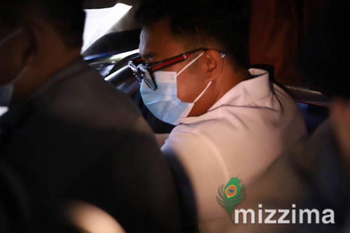 Canadian pastor David Lah (R) is escorted by police as he leaves the Mayangone township court in Yangon on August 6, 2020. Photo: Thura/Mizzima