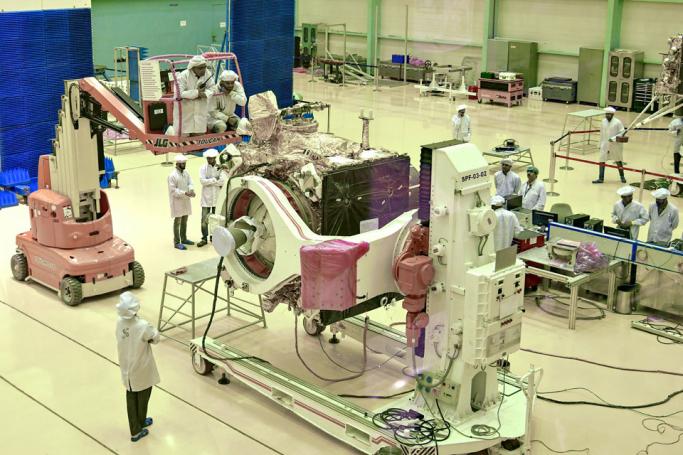 (FILES) In this file photo taken on June 12, 2019, Indian Space Research Organisation (ISRO) scientists work on the orbiter vehicle of 'Chandrayaan-2', India's first moon lander and rover mission planned and developed by the ISRO, in Bangalore. India will make a second attempt on July 22 to send a landmark spacecraft to the Moon after an apparent fuel leak forced last week's launch to be aborted. Photo: Manjunath Kiran/AFP
