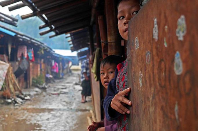 Two children look to the camera at an IDP camp in Myanmar’s northern Kachin State. Photo: Steve Sandford/IRIN
