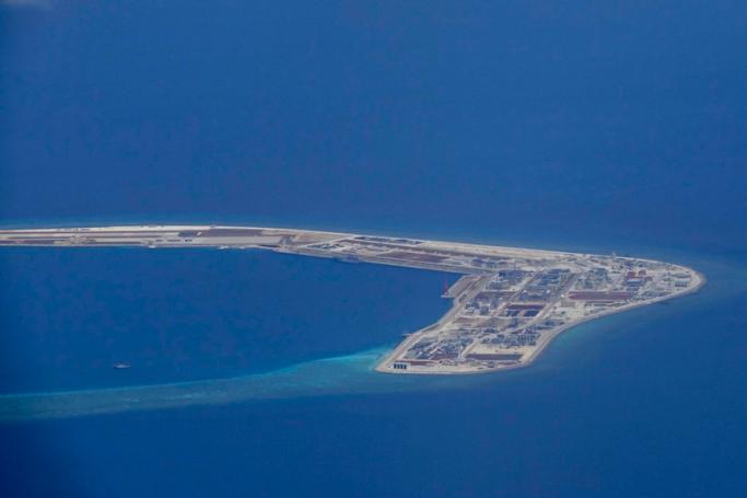 An aerial view of the Subi reef, one of the tiny islands being claimed by China in the disputed South China Sea, photographed through an aircraft's window on 21 April 2017. Photo: EPA