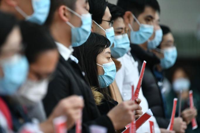 Local medical workers hold a strike near Queen Mary Hospital as they demand the city close its border with China to reduce the coronavirus spreading, in Hong Kong on February 3, 2020. Photo: AFP