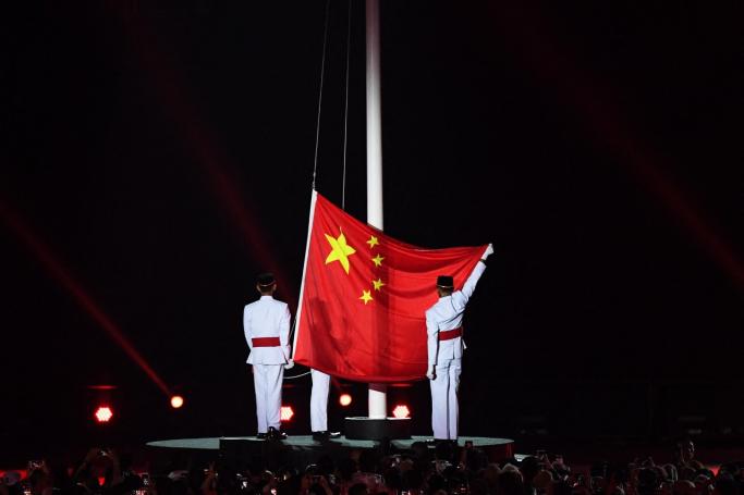 (File) The Chinese national flag is hoisted during the closing ceremony of the 2018 Asian Games at the Gelora Bung Karno main stadium in Jakarta on September 2, 2018. Photo: AFP