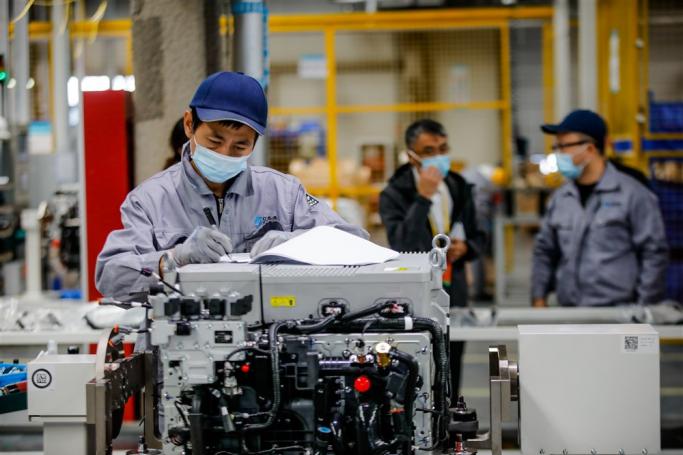 An employee works at SinoHytec Fuel Cell Engine Plant at Daxing International Hydrogen Energy Demonstration Zone in Beijing, China. Photo: EPA