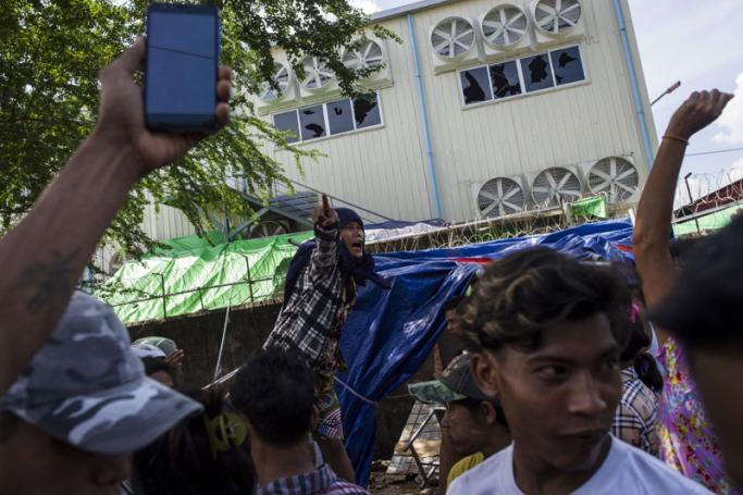 Myanmar residents shout slogans near the Chinese-owned Fu Yuen Garment factory after armed thugs beat up and hospitalised some workers on strike. Photo: Ye Aung Thu/AFP