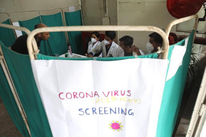 Indian doctors screen patients as the precautionary measure for Coronavirus COVID19 at a separate Coronavirus screening section in Nehru Homoeopathic Medical College and Hospital in New Delhi, India, 14 March 2020. Photo: EPA