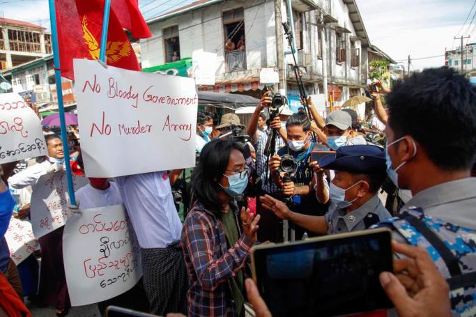 Student activists hold placards during a protest against the presence of Myanmar army in Rakhine state, in Sittwe, Rakhine State, Myanmar, 19 October 2020. Photo: Nyunt Win/EPA