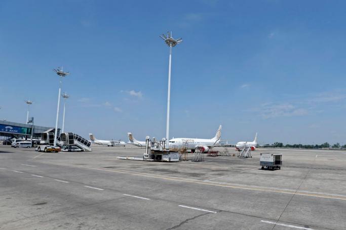 Myanmar National Airlines (MNA) aircraft parked on the tarmac as commercial flights remain temporarily suspended as part of the measures to control the spread of the COVID-19 coronavirus disease, at Yangon International Airport in Yangon, Myanmar. Photo: Nyein Chan Naing/EPA