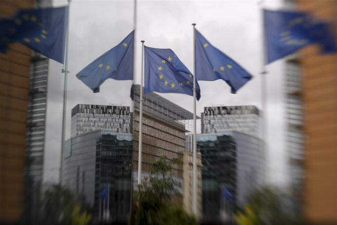 A picture taken with a Lensbaby shows European union flags near the European Commission headquarters, in Brussels, Belgium. Photo: EPA