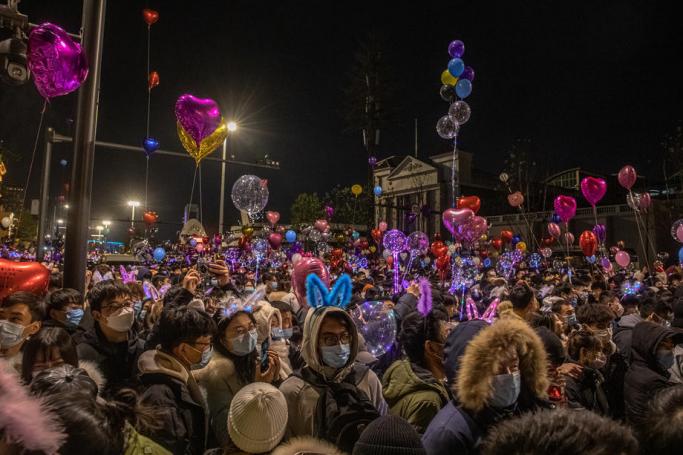 People gather in a street to celebrate the New Year in Wuhan, China, 31 December 2020. Photo: EPA