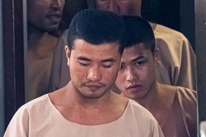 (FILES) In this file photo taken on August 29, 2019, Myanmar prisoners Zaw Lin (C) and Win Zaw Tun (R) leave the court in Nonthaburi after the verdict. Photo: AFP