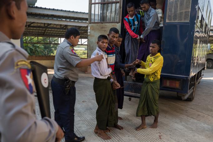 (File) Rohingya detainees step out of a police van upon arriving at the court in the western Myanmar city of Pathein ahead of a hearing on December 11, 2019. Photo: AFP