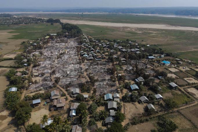 This handout photo by Chin Twin Chit Thu taken on February 3, 2022 and released on taken on February 5, 2022 shows an aerial photo of burnt buildings from fires in Mingin Township, in Sagaing Division, where more than 105 buildings were destroyed by junta military troops, according to local media. Photo: AFP