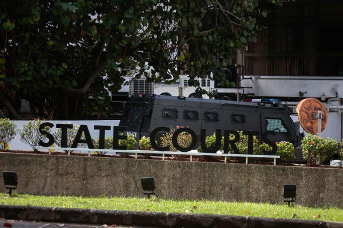 An armoured police van carrying detained Bangladeshi nationals, from a group of eight, is pictured against the signage of the State Court in Singapore, 31 May 2016. Photo: Wallace Woon/EPA
