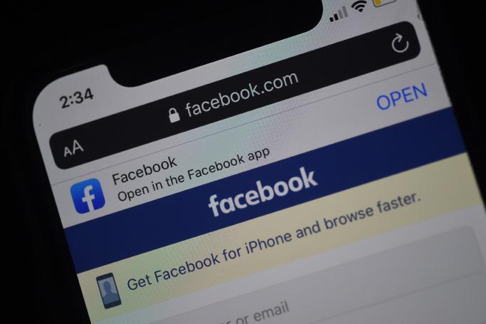 In this photo illustration a Facebook login page is displayed on a smartphone. Photo: AFP