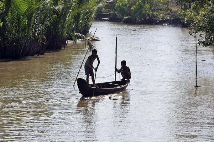 Myanmar men fishing in the river at Thagyarhinoh village, Pyarpone, Ayeyawaddy delta. Photo: Nyein Chan Naing/EPA
