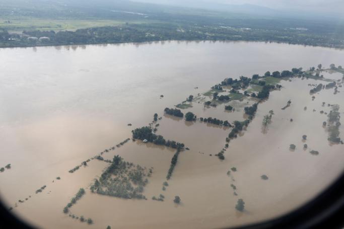 A photograph taken from airplane window shows flooded area beside the Ayeyarwaddy river in Myitkyina, Kachin State, Myanmar, 13 July 2019. Photo: Nyein Chan Naing/EPA