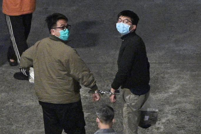 Activists Joshua Wong (R) and Ivan Lam (L) arrive at Lai Chi Kok Reception Centre in Hong Kong on December 2, 2020, after being sentenced after pleading guilty to inciting a rally during pro-democracy protests in 2019, deepening the crackdown against Beijing's critics. Photo: AFP