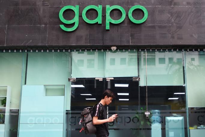 A man walks past the Gapo office in Hanoi on July 24, 2019. Gapo, a homegrown Vietnamese social media app, was overloaded with users hours after launching as the one-party state tries to boost its own web platforms while tightening its grip on internet freedoms. Photo: Nhac Nguyen/AFP