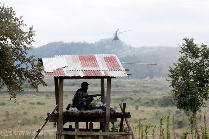 A Myanmar border guard police officer mans his station at the Goke Pi police outpost, in Buthidaung Township, northern Rakhine State, western Myanmar, 07 January 2019. Photo: Hein Htet/EPA