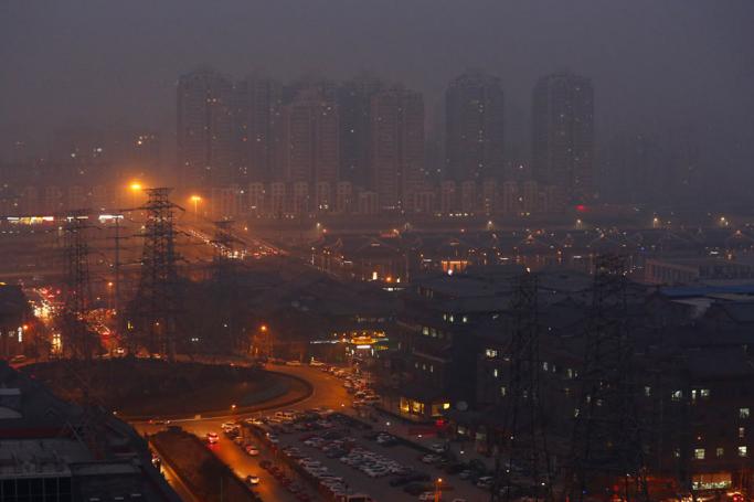 Haze hangs over downtown Beijing city, China. Photo: EPA