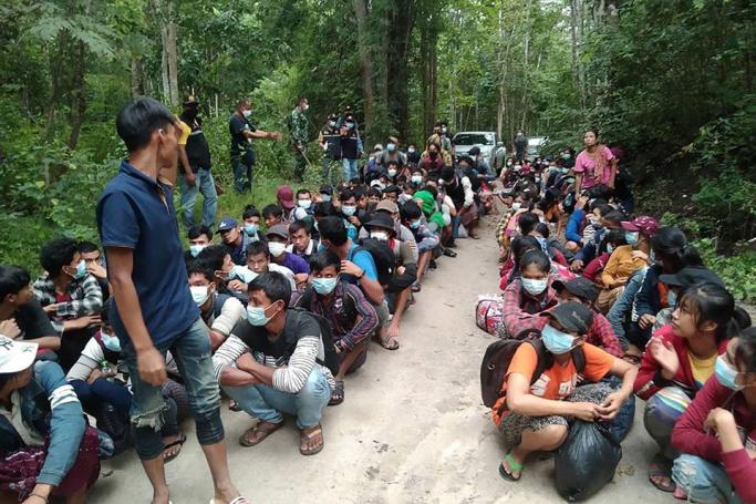 In this handout photo from the Royal Thai Army released on October 25, 2021, Myanmar migrants are pictured after being apprehended by the Thai military personnel in Kanchanaburi province, bordering Myanmar. Photo: ROYAL THAI ARMY / AFP
