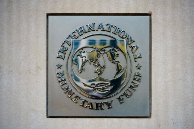 The seal of the International Monetary Fund (IMF) is seen outside of a headquarters building in Washington, DC on April 7, 2021. Raising taxes on wealthy firms that have done well during the pandemic is increasingly viewed as a source of revenue to finance pandemic recovery efforts, an idea pushed Wednesday by the IMF and the US. Photo: AFP