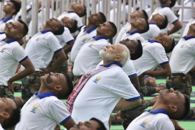 (File)  Indian Prime Minister Narendra Modi (C) performs yoga on the fifth annual International Yoga Day in Ranchi, Jharkhand, India, 21 June 2019. Photo: EPA