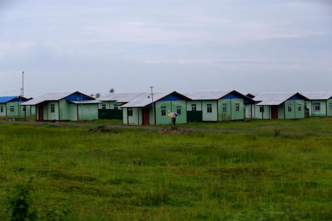 (File) A man walks in front of the newly built houses for resettlement at the Kyauk BanDu village in Maungdaw township, Rakhine State, western Myanmar, 23 August 2018. Photo: Nyein Chan Naing/EPA