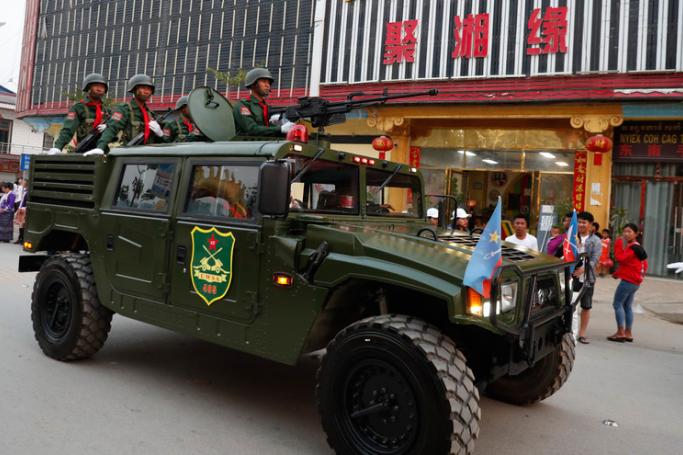 (File) An armored fighting vehicle of the United Wa State Army (UWSA) drives in a downtown area of Panghsang, also called Pang Kham, autonomous Wa region, north-eastern Myanmar, 17 April 2019. Photo: Lynn Bo Bo/EPA