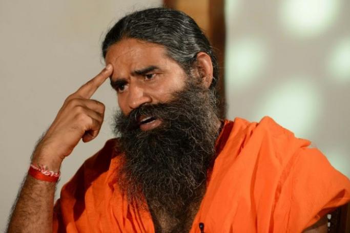 Indian Yoga Baba Ramdev has been told to stop touting a supposed $7 coronavirus cure (AFP Photo/SAM PANTHAKY) 