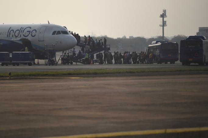 In this photograph taken on March 2, 2020, passengers queue to board on an IndiGo aircraft at Indira Gandhi International airport in New Delhi. Photo: Money Sharma/AFP